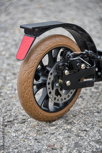 The rear wheel of the scooter has a disc and foot brake.