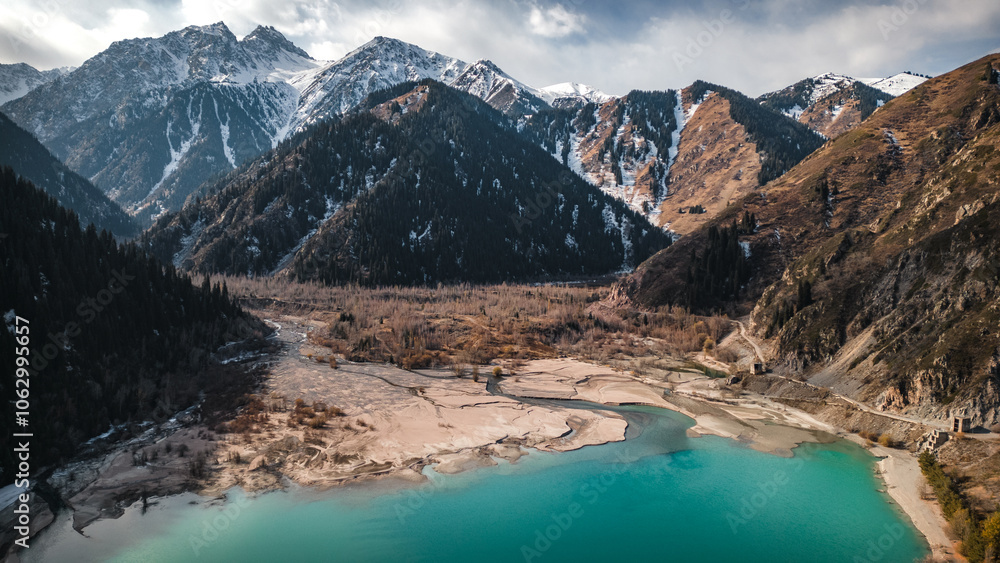 Horizontal landscape drone view on lake and mountain snow peaks Horizontal landscape drone view on lake and mountain snow peaks