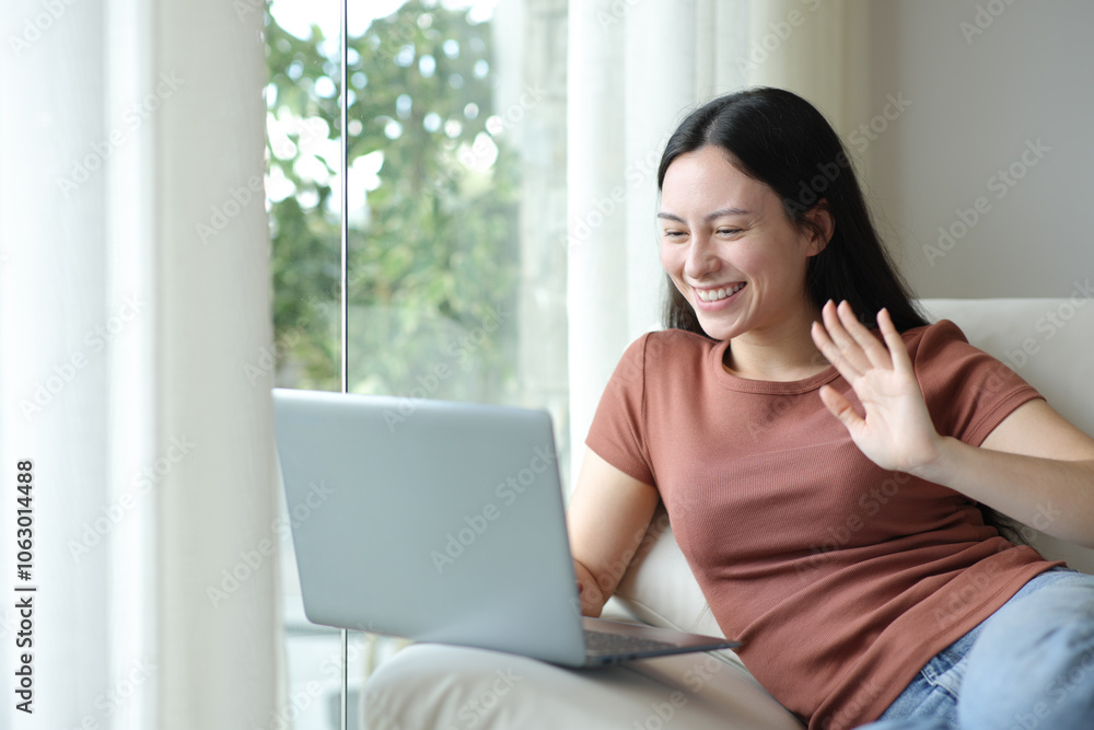 Happy asian woman having video call at home Happy asian woman having video call at home