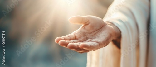 Jesus extending his hand to a fallen person, the light of forgiveness shining from his palm, symbolizing faith in second chances photo