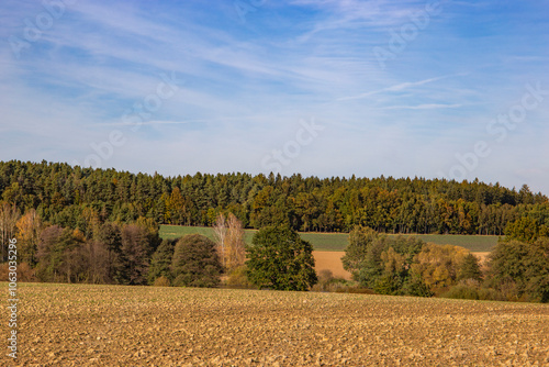 An autumn landscape with fields and forests in Central Europe.
