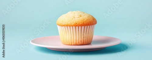 Delicious lemon poppy seed muffin displayed on a soft pastel background, perfect for a sweet treat or breakfast idea. photo