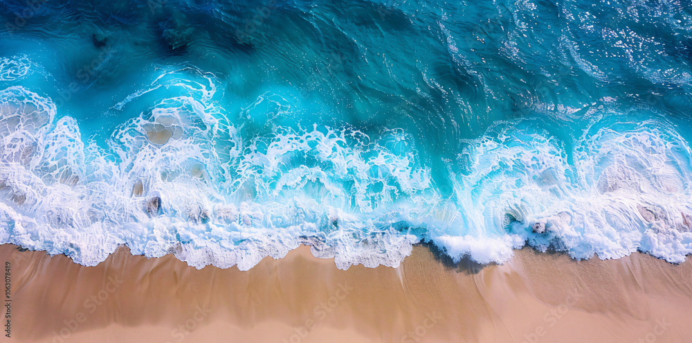 Beautiful turquoise sea and beach from above, top view of the ocean with waves and sand for background or wallpaper. Aerial drone photo. Shallow depth of field. Beautiful turquoise sea and beach from above, top view of the ocean with waves and sand for background or wallpaper. Aerial drone photo. Shallow depth of field.