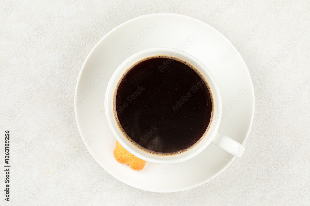 White cup of fresh brewed black coffee with cookie White cup of fresh brewed black coffee with cookie