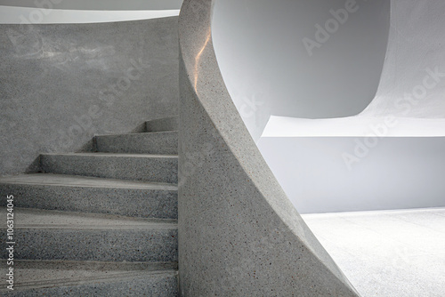 Architecture details of concrete spiral staircase with beautiful curve and soft light and shadow 