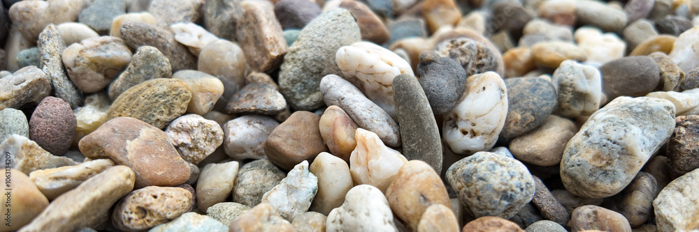 Close-up of smooth river stones, symbolizing tranquility and natural beauty, ideal for Earth Day and environmental concepts Close-up of smooth river stones, symbolizing tranquility and natural beauty, ideal for Earth Day and environmental concepts