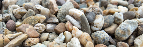 Close-up of smooth river stones, symbolizing tranquility and natural beauty, ideal for Earth Day and environmental concepts