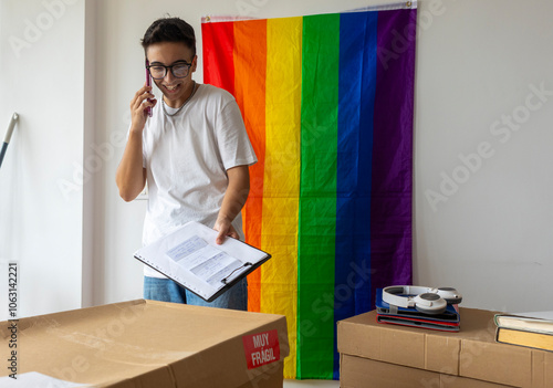 Trans man coordinates moving into new home, showcases pride flag