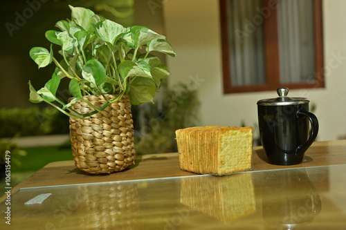 Morning coffee and biscuit served on wooden table