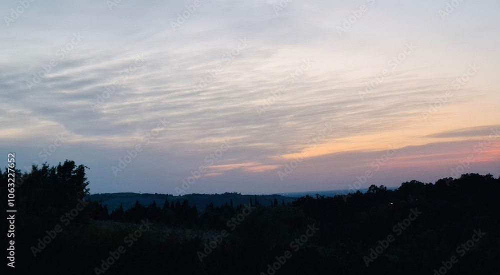 Sky with clouds at sunset over the hills Sky with clouds at sunset over the hills
