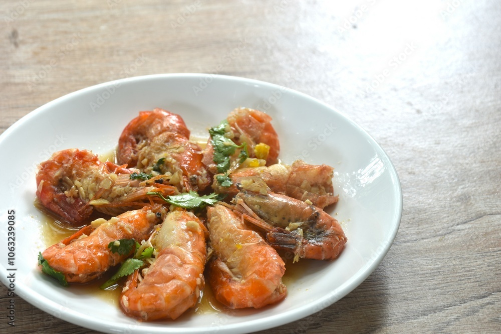deep fried salty river shrimp with chop garlic and pepper in fish sauce arranging on plate deep fried salty river shrimp with chop garlic and pepper in fish sauce arranging on plate