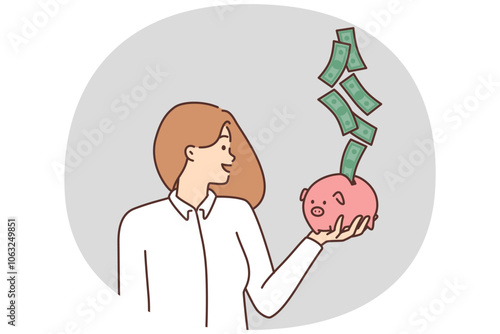 Smiling woman with piggybank excited with cash flow