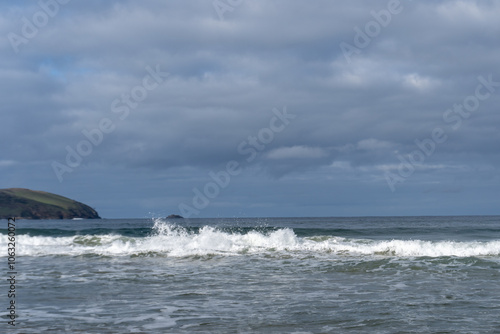 waves crashing with a dark sky above 