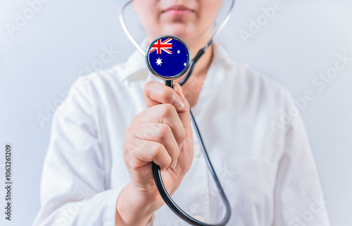 Australia National Healthcare concept. Female doctor showing stethoscope with Australia flag