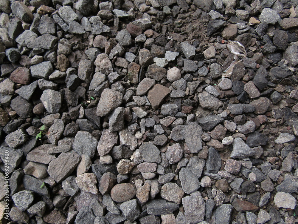 Natural Background Collection of Sharp Split Gravel Stones in Gray and Black Colors Containing Coal and Coarse Textured Granite for Concrete. Industrial Recycled Natural Gravel. Closeup Photography Natural Background Collection of Sharp Split Gravel Stones in Gray and Black Colors Containing Coal and Coarse Textured Granite for Concrete. Industrial Recycled Natural Gravel. Closeup Photography