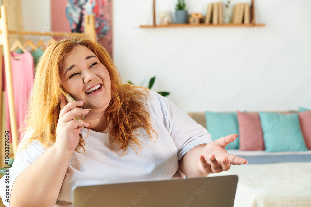 A cheerful woman enjoying a phone conversation, surrounded by a cozy and stylish living space. A cheerful woman enjoying a phone conversation, surrounded by a cozy and stylish living space.