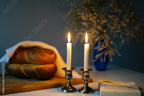 Photos Traditional challah bread with wine and glowing candles on dark background