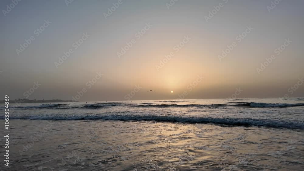 beautiful Sunrise on the beach with sand, sun, waves, seagulls and sea. beautiful Sunrise on the beach with sand, sun, waves, seagulls and sea.