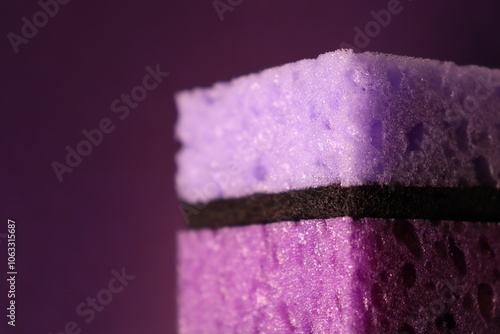 stylish dark sponges for washing dishes and cleaning on a purple background