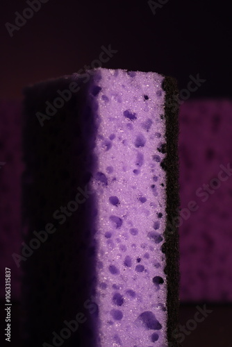 stylish dark sponges for washing dishes and cleaning on a purple background
