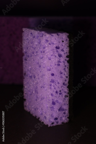 stylish dark sponges for washing dishes and cleaning on a purple background