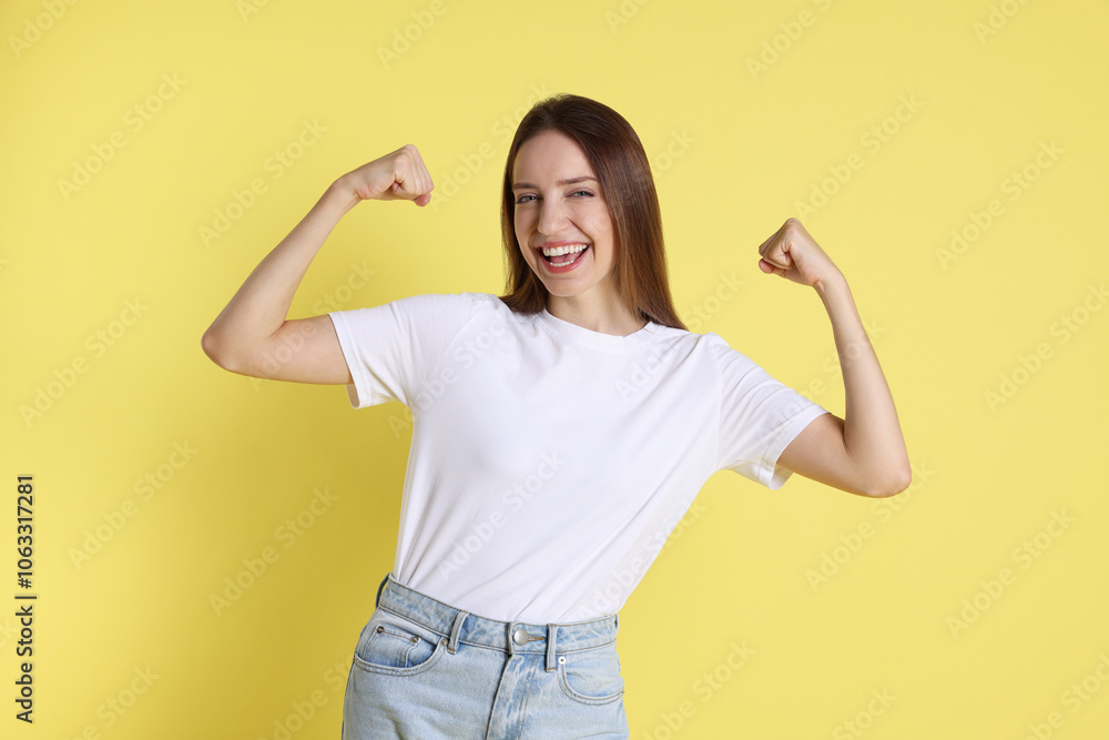 Portrait of happy winner on yellow background Portrait of happy winner on yellow background