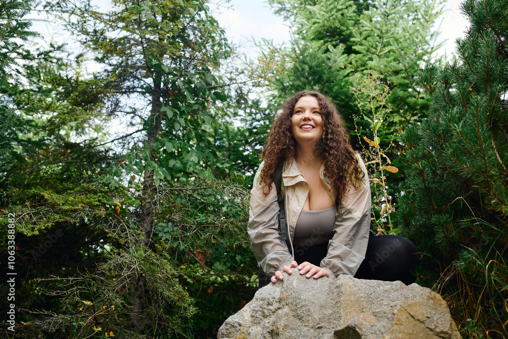 A beautiful woman explores the tranquility of nature, radiating joy in a verdant forest. A beautiful woman explores the tranquility of nature, radiating joy in a verdant forest.