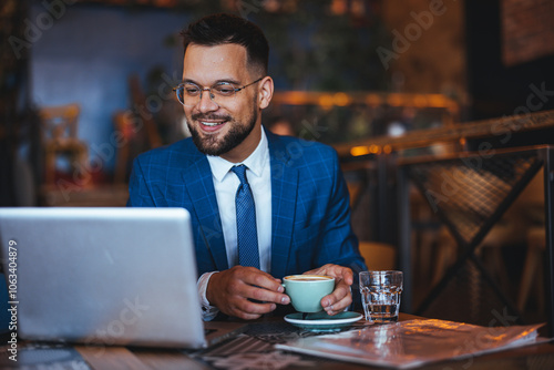 Young Professional Enjoying Coffee Break in Modern Cafe