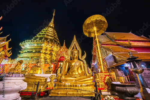 Obraz na płótnie Wat Phra That Doi Suthep is a Buddhist temple is a major tourist attraction Is an ancient Thai art with Twilight blue bright at dusk night and Public places in Chiang Mai,Thailand. w salonie