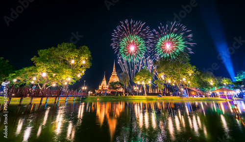 Obraz na plátně Beautiful Firework scene light color Sukhothai Co Lamplighter Loy Krathong Festival party at The Sukhothai Historical temple park covers the ruins of Sukhothai, in what is now Northern Thailand