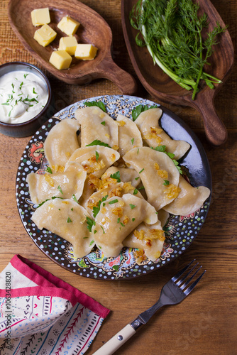 Dumplings filled with ground meat. Varenyky, vareniki, pierogi, pyrohy - dumplings with filling. View from above, top studio shot