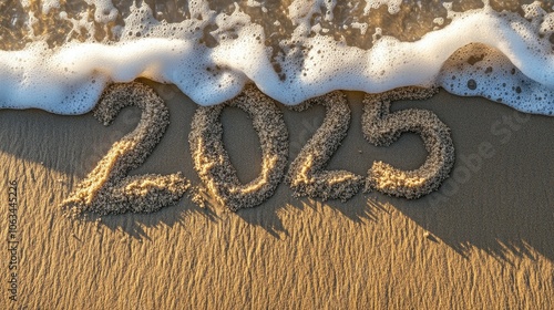 Sand Number on Beach with Waves for New Year Concept photo