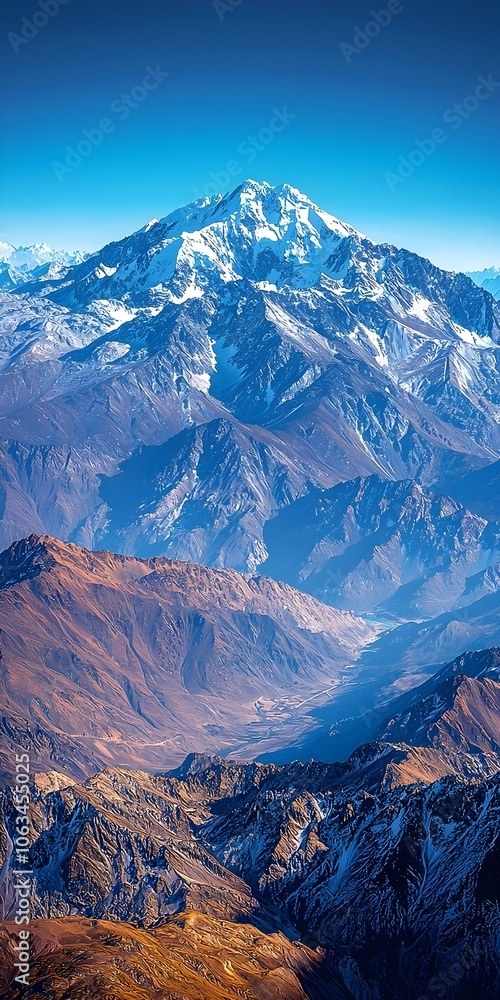 Majestic snow-capped mountain with rugged peaks and valleys in the foreground, bathed in bright sunlight, showcasing the beauty of nature in a stunning landscape. Majestic snow-capped mountain with rugged peaks and valleys in the foreground, bathed in bright sunlight, showcasing the beauty of nature in a stunning landscape.