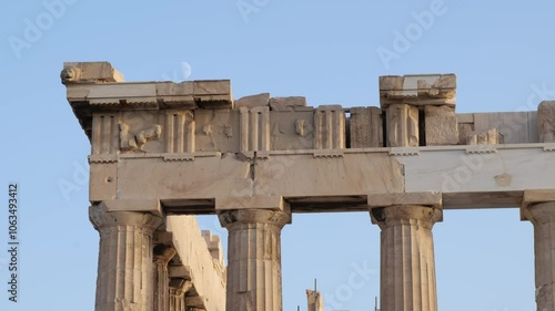 Parthenon Temple and Waxing Moon at the Acropolis in Athens Greece Blue Sky Afternoon Timelapse