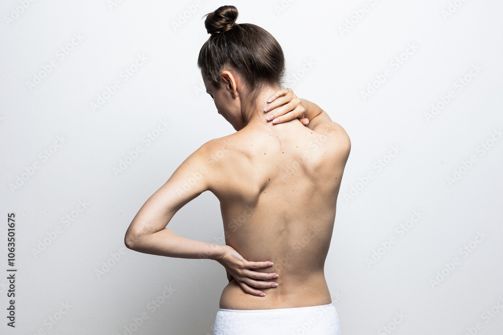 Back view of a woman with great skin. Pai, skin care. Isolated on white background. Back view of a woman with great skin. Pai, skin care. Isolated on white background.