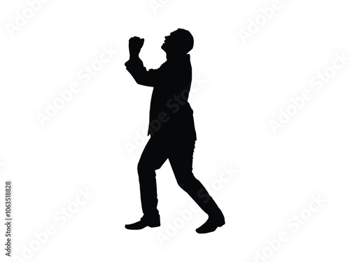 Silhouette of a man in a suit with hands clasped and looking up as if pleading for mercy or forgiveness or for praying

