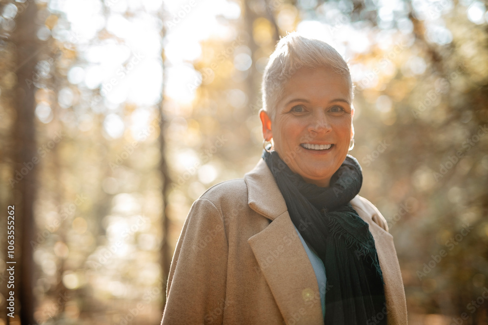 Mature woman in autumn forest, dressed in cozy fall attire, Reflection and connection with nature, wellness Mature woman in autumn forest, dressed in cozy fall attire, Reflection and connection with nature, wellness