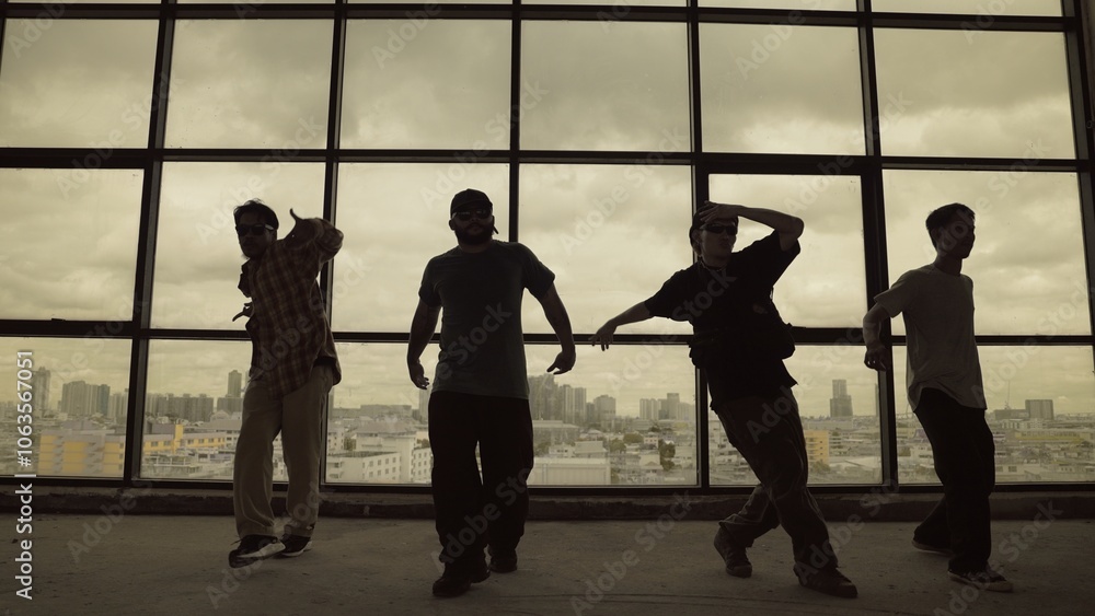 Silhouette shot of skilled choreographer group dancing together with sky scrapper, cityscape background. Young hipster team dancing performance. Sepia filter. Shadow. Outdoor sport 2024. Hiphop. Silhouette shot of skilled choreographer group dancing together with sky scrapper, cityscape background. Young hipster team dancing performance. Sepia filter. Shadow. Outdoor sport 2024. Hiphop.