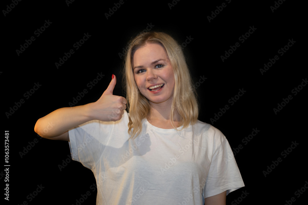 Woman in white t-shirt Showing Thumbs Up Gesture with a Happy Expression Woman in white t-shirt Showing Thumbs Up Gesture with a Happy Expression