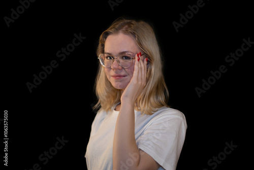 Fotografie Thoughtful Young Woman with Glasses Touching Face and glasses
