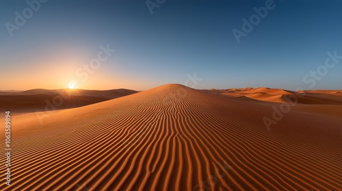 Serene desert landscape at sunrise with rippling sand dunes