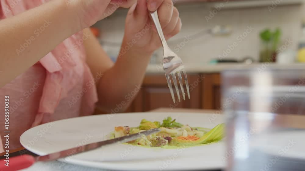 Woman's Hands Cut And Fork Fish On Plate Woman's Hands Cut And Fork Fish On Plate