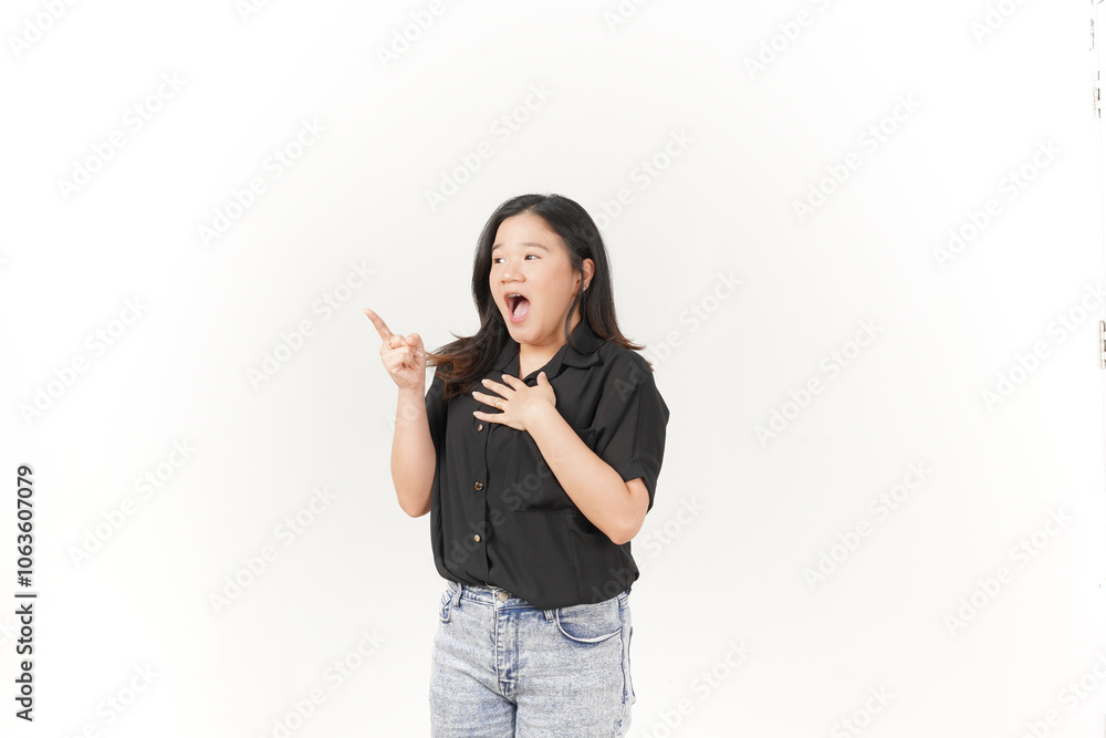 beautiful Asian woman with a shocked expression points emphatically, highlighting surprise against a white background beautiful Asian woman with a shocked expression points emphatically, highlighting surprise against a white background