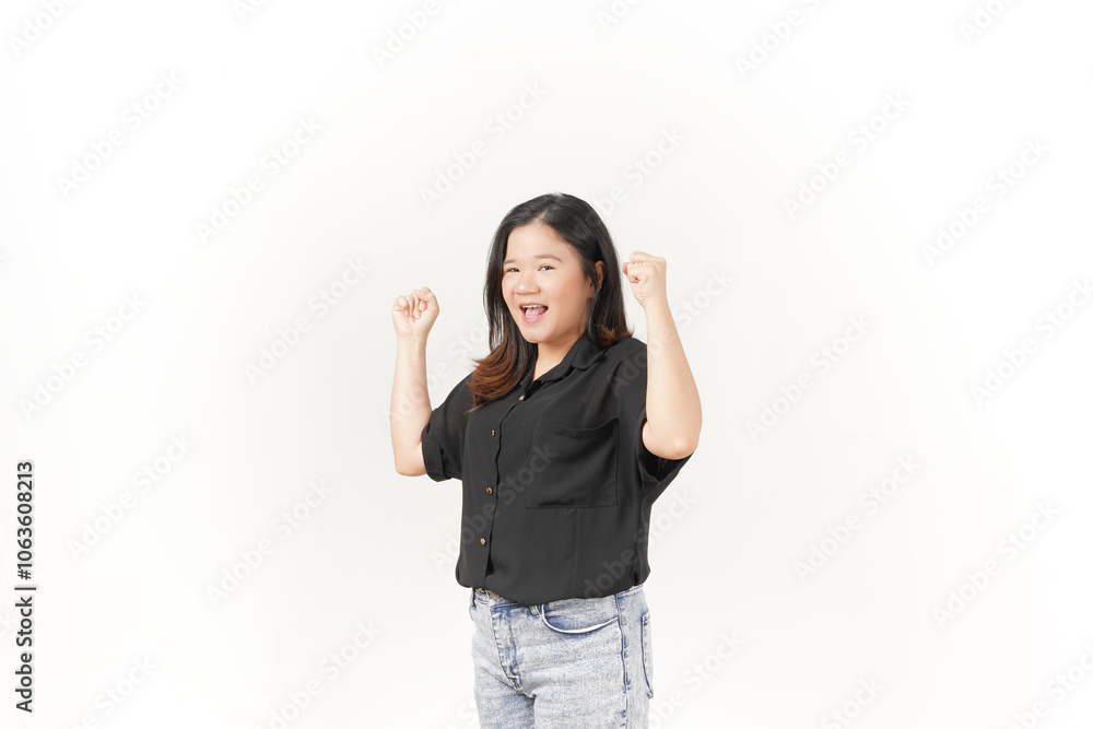 beautiful Asian woman displays a joyful expression, raising her hand in a celebratory gesture against a white background beautiful Asian woman displays a joyful expression, raising her hand in a celebratory gesture against a white background