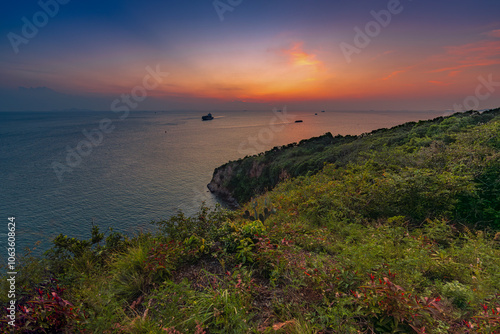 Khao Laem Chabang Viewpoint is a tourist attraction and a beautiful sunset viewing point. It also offers a view of the port, industrial estates, and oil and gas refineries in the Laem Chabang area. photo