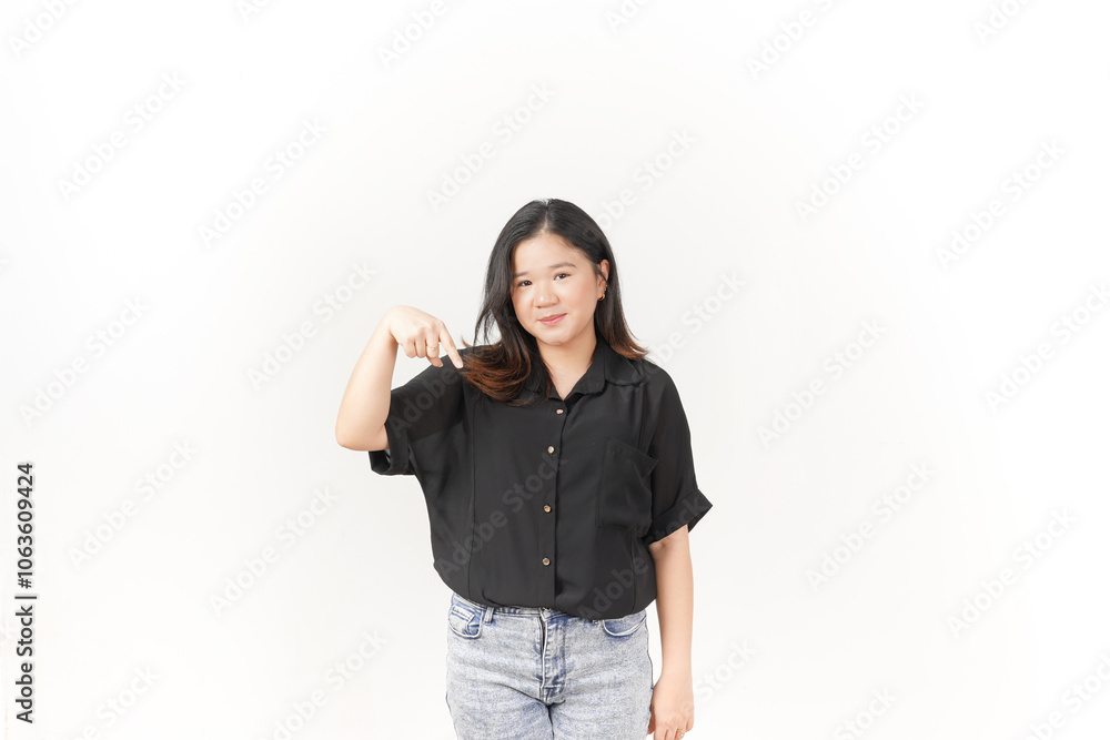 beautiful Asian woman smiles brightly while pointing downward, set against a clean white background beautiful Asian woman smiles brightly while pointing downward, set against a clean white background