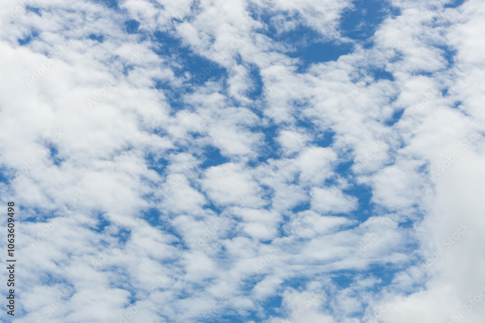 Many clouds on a bright blue sky background in a beautiful day Many clouds on a bright blue sky background in a beautiful day