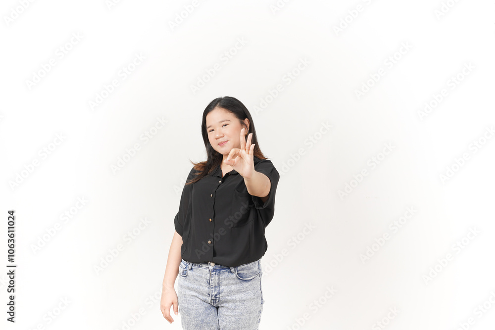 beautiful Asian woman smiles warmly while making an 'OK' hand gesture against a bright white background beautiful Asian woman smiles warmly while making an 'OK' hand gesture against a bright white background
