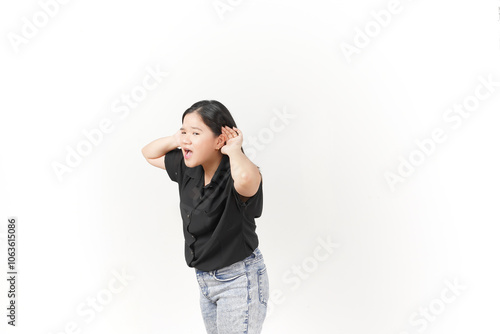 beautiful Asian woman poses with her hands on both ears, trying to listen attentively against a white background