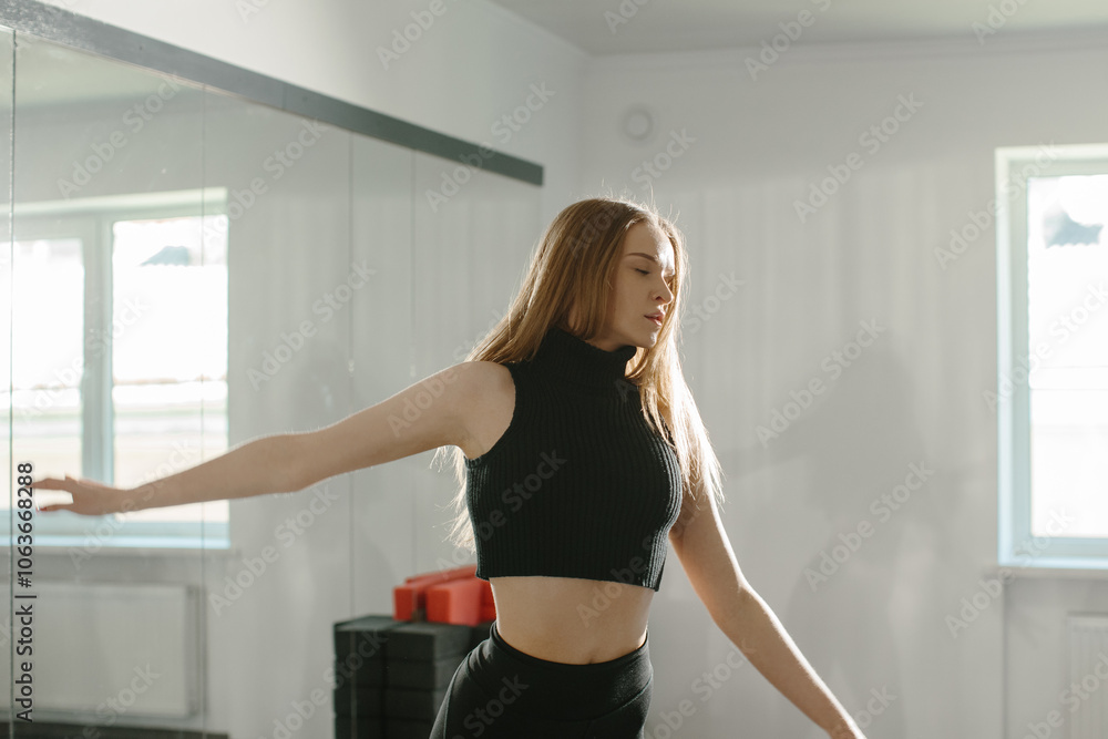 Young woman performing a dance routine with energy Young woman performing a dance routine with energy